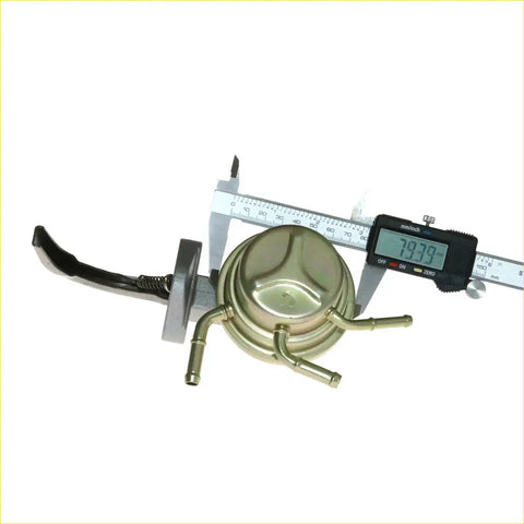 Gold-colored metal fuel filter with black rubber hose and silver fittings for fuel pump assembly nissan navara d21