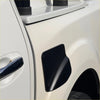 Black matte-finish fuel tank cap cover with textured surface and angular design for nissan navara np 300 2015-2020