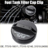 Black plastic fuel tank filler cap with molded warning text and textured surface for toyota previa 1994-1997