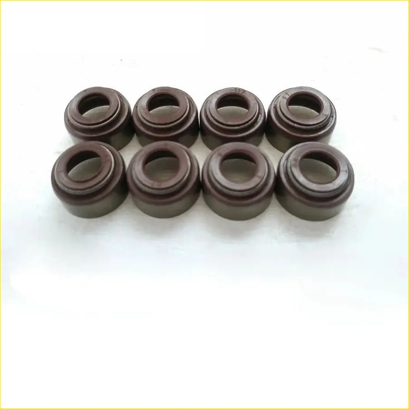 Eight dark brown cylindrical valve stem oil seals for toyota dyna 200 diesel chassis by gasket pro arranged in two rows