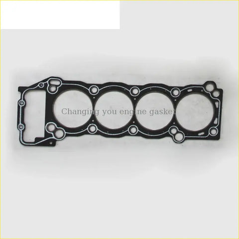 Black engine head gasket with four circular openings and cutouts for cylinder alignment for toyota hilux 3rZfe
