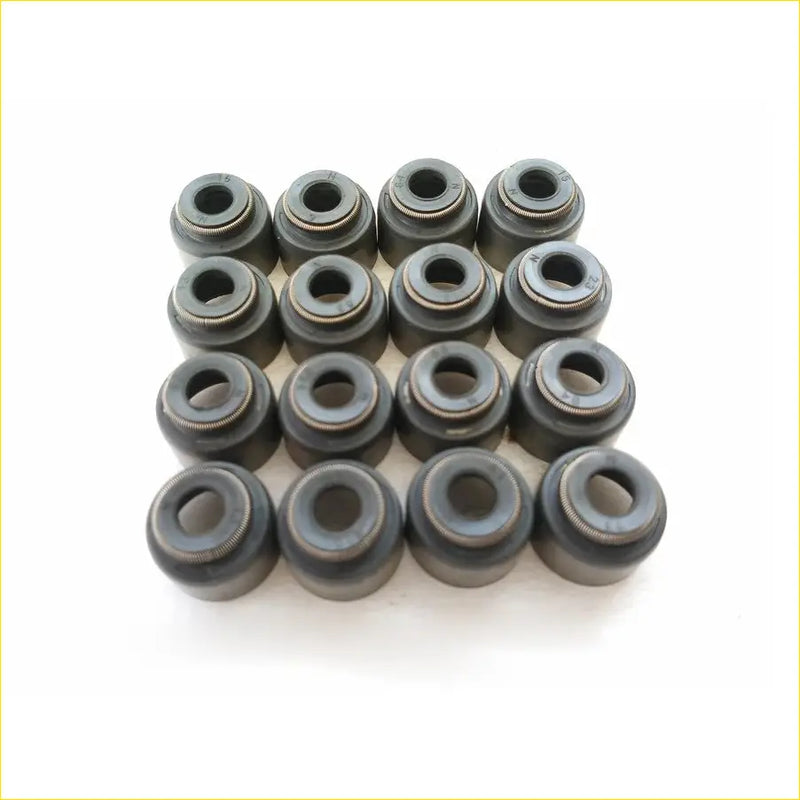 Black rubber and metal valve stem oil seals arranged in a grid for mitsubishi grandis 4g69 16pcs gasket pro