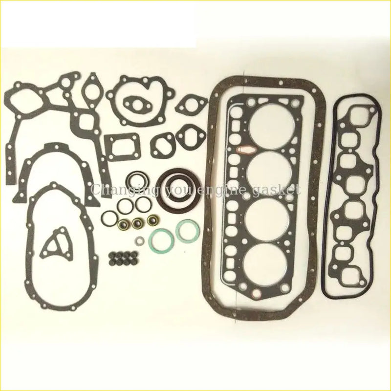 Black rubber engine gasket set with various shapes including large rectangular head gasket for toyota hilux 4y full set
