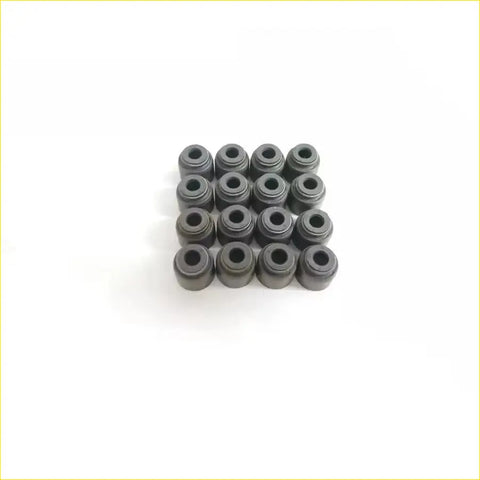 Black rubber valve stem oil seals arranged in a grid for gasket pro cg10de cg13de nissan micra 16v engines