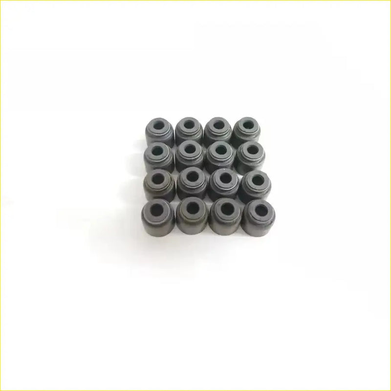 Black rubber valve stem oil seals arranged in a grid for gasket pro cg10de cg13de nissan micra 16v engines