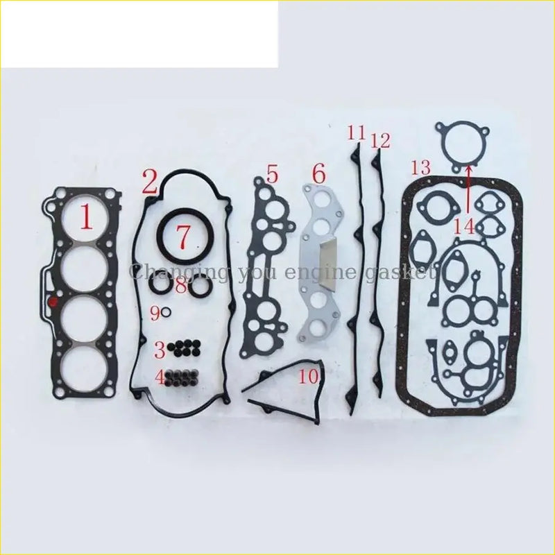 Black rubber engine gasket set with metallic parts and labeled components for gasket pro f6 mazda 626 ii or 626 iii 1.6
