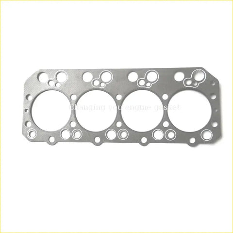 Silver metallic engine head gasket with four large circular openings and bolt holes for nissan truck cylinder head use