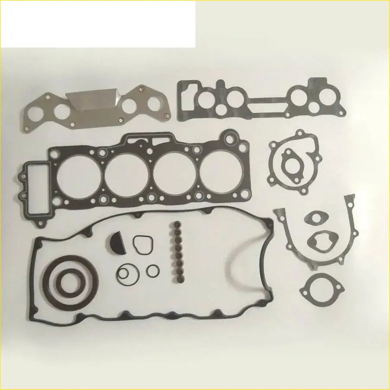Black and silver engine gasket set for mazda 626 2.0l featuring various shapes and hole patterns for automotive use