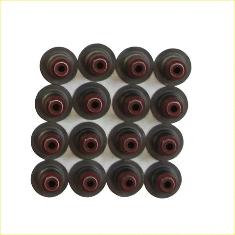 Black and maroon rubberized valve stem caps arranged in a grid for gasket pro daewoo nubira chevrolet valve seal pack