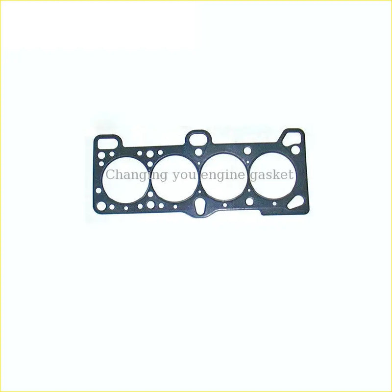 Black metal cylinder head gasket with four circular openings and small holes for hyundai accent iii g4ed engine