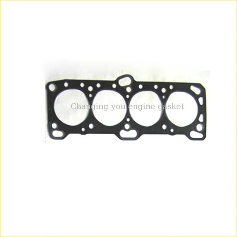 Black engine head gasket with four circular openings and edge holes for mitsubishi l300 l200 galant hyundai h1 sonata 2.4