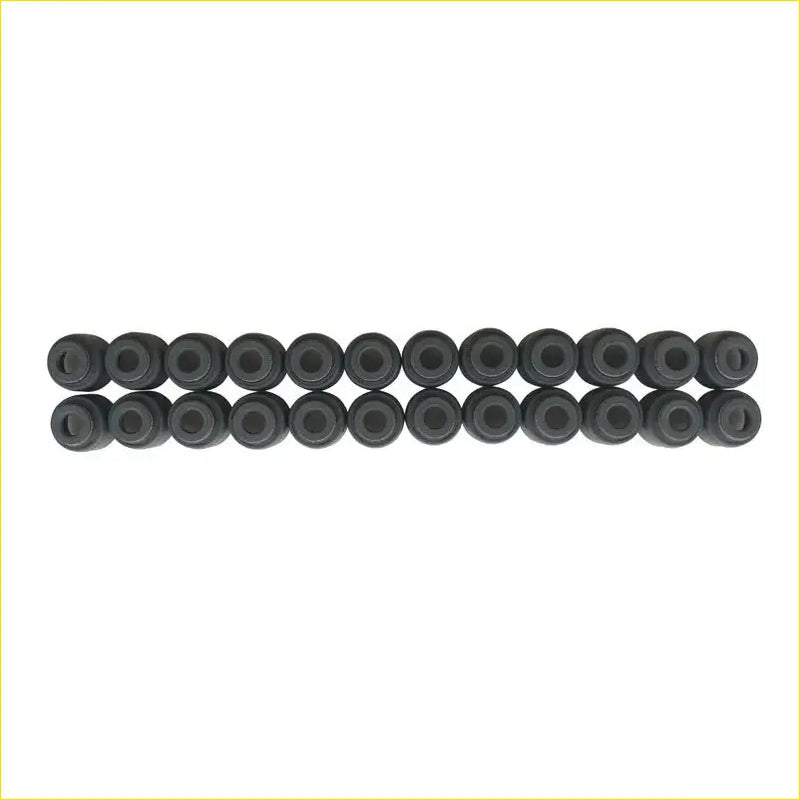 Black rubber grommets arranged in two rows for gasket pro mitsubishi outlander ii valve stem oil seal gasket md307342