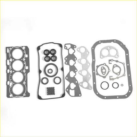 Set of black and silver automotive engine gaskets with cutouts for cylinder heads oil pan and intake manifold for mitsubishi pajero mini 700 dohc 4a30 md