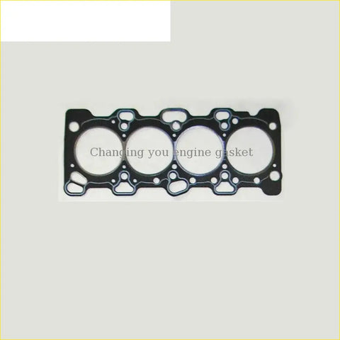 Black textured engine head gasket with four circular openings for mitsubishi space gear delica 16v 4g63 v31 md346924