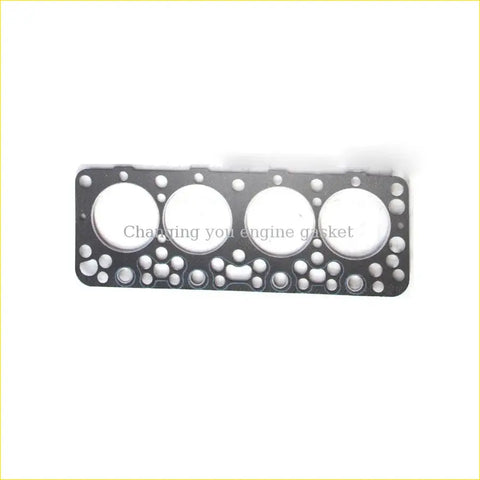Black engine head gasket with four circular openings and smaller holes for nissan pick-up 720 king-cab urvan sd23