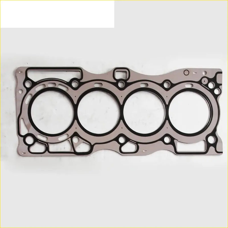 Metallic gray engine head gasket with four circular openings and black rubber seals for nissan primera x-trail cylinder head