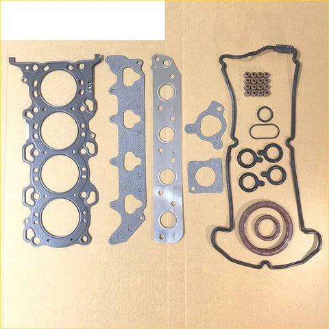 Set of metallic gray engine head gaskets and black rubber and brown silicone seals for suzuki wagon r 16v 1.0l k10a