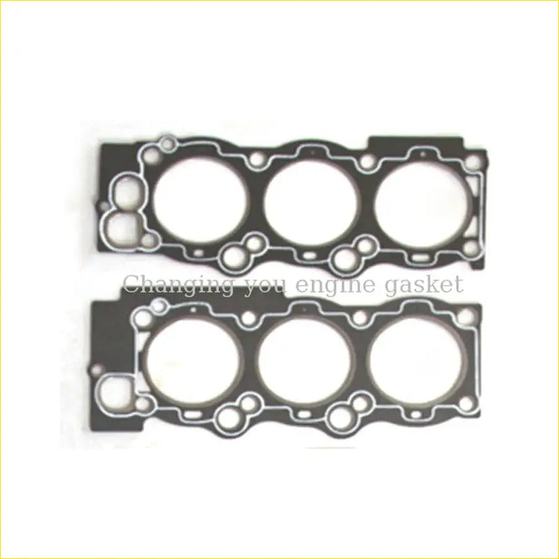 Black engine head gasket set with three circular openings and precise cutouts for toyota camry 3vzte 24v cylinder heads