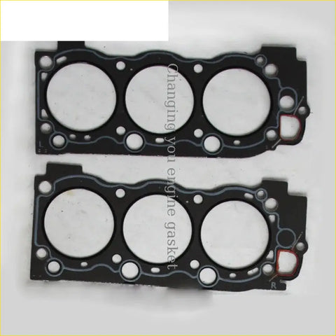 Black engine head gaskets with three circular openings and red accent for gasket pro toyota hilux 5vzte 2pcs shim