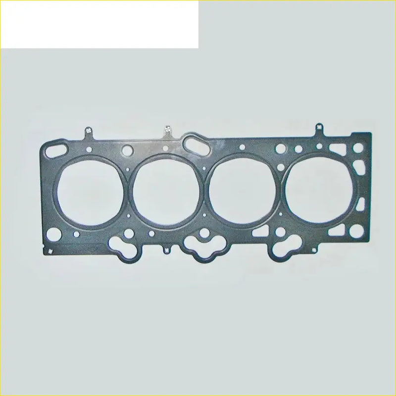 Black metal cylinder head gasket with four circular openings and textured surface for hyundai elantra 16v dohc