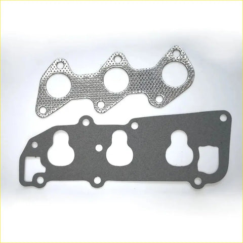 Two metallic engine head gaskets for gasket pro mitsubishi minica minicab with textured and smooth surfaces