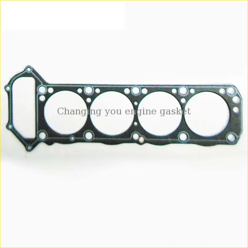 Black engine head gasket with four circular openings and rectangular cutout for nissan urvan d21 truck pick-up