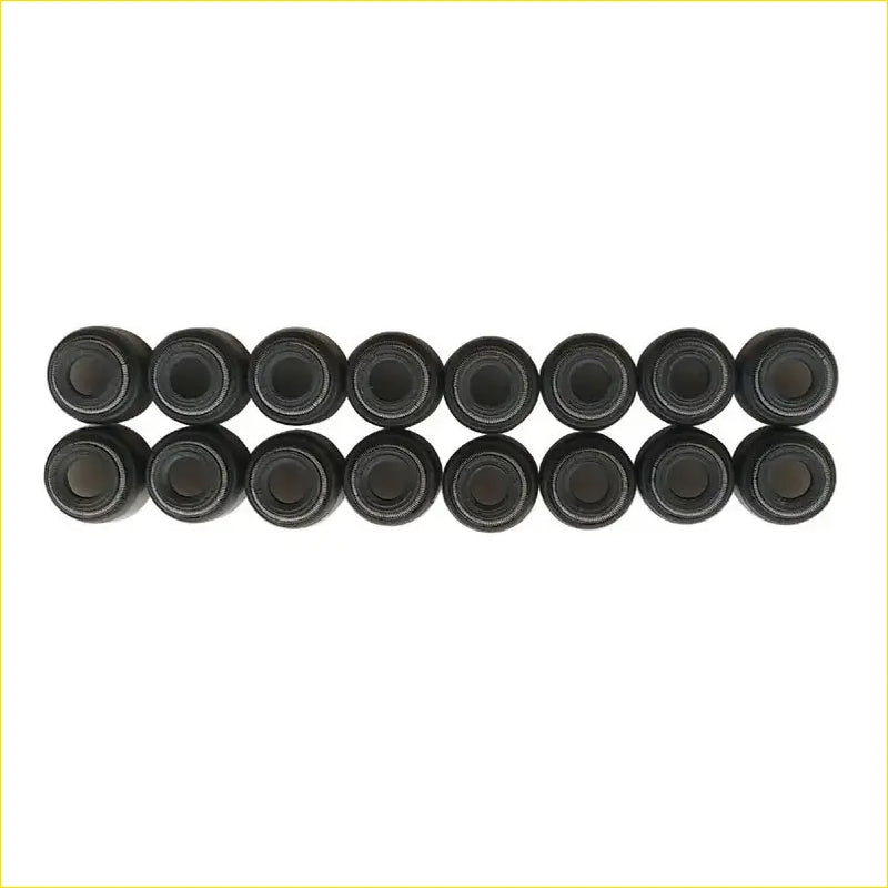 Black cylindrical valve stem oil seals arranged in two neat rows for gasket pro nissan xtrail t30 16pcs set