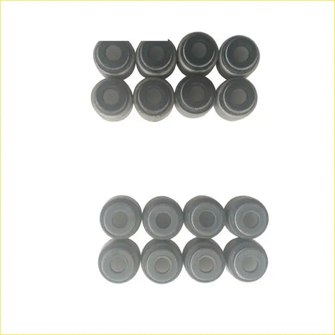 Set of sixteen black rubber valve stem oil seals arranged in two rows for gasket pro toyota corolla celica 1.8l 7a-fe