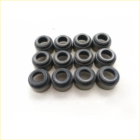 Black rubber gasket seals arranged in a grid for gasket pro toyota landcruiser coaster diesel engine valve stem oil seal