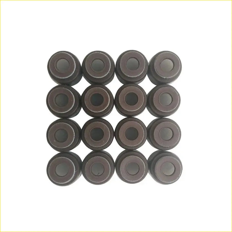 Dark gray metallic valve stem oil seals arranged in a grid for toyota prius nhw11 1nz-fxe engines by gasket pro