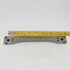 Gray plastic grab handle with molded mounting brackets for mitsubishi triton strada 2012-2016 shown from back side