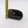 Gray lh door handle for Mazda B-Series made of black plastic with curved design and mounting hole shown from back side