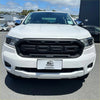 White ford ranger pickup truck with black grille and sleek headlights showing grille for ford ranger px3 2019-2021