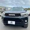 Black toyota hilux pickup truck with chrome grille and roof rack featuring grille for hilux 2015-2020 model