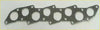 Metallic gray textured head gasket with multiple circular cutouts and bolt holes for shogun l200 l300 l400 pajero montero challenger