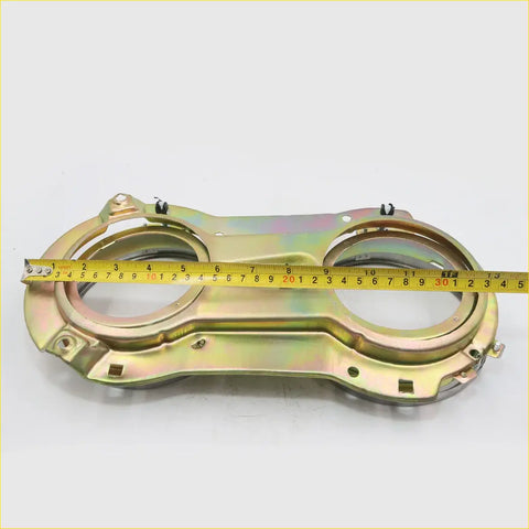 Gold-colored metal head light brackets with two circular openings and mounting brackets for nissan datsun 620