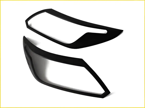 Black plastic headlight cover trim pieces for colorado trailblazer 2017 to 2019 shown from the back side