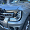 Silver ford ranger 2022 headlight and taillight covers with modern angular design and chrome grille accents