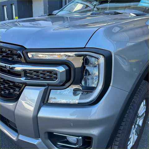 Silver ford ranger 2022 headlight and taillight covers with modern angular design and chrome grille accents