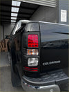 Black ford colorado pickup truck rear with matte headlight and taillight covers for holden colorado 2012-2016
