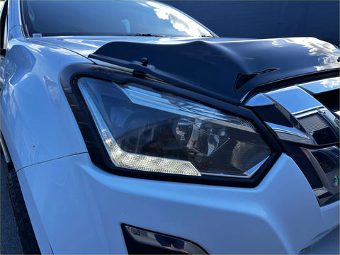 Sleek white isuzu d-max headlight with sharp angular design chrome accents and led lighting for 2016-2020 models