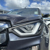 Black matte finish headlight cover for isuzu d-max 2021-2023 with sleek angular led daytime running lights and clear lens housing