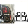 Black plastic tail light bezel trim for toyota hilux 2012-2015 pickup truck shown from the back side