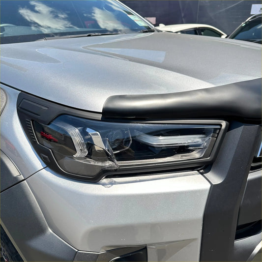 Silver metallic suv headlight cover with black trim and clear lens housing for toyota hilux 2021-2024 sr sr5