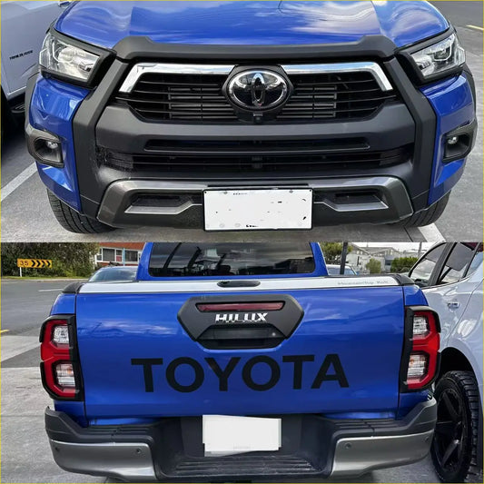 Blue toyota hilux 2025 sr5 with matte headlight and taillight covers black grille and rear bed cover toyota lettering