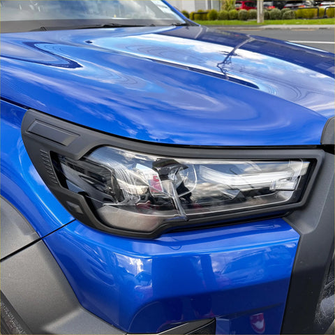 Headlight cover for toyota hilux 2025 sr5 matte blue with sleek black trim and integrated led lighting clear lens