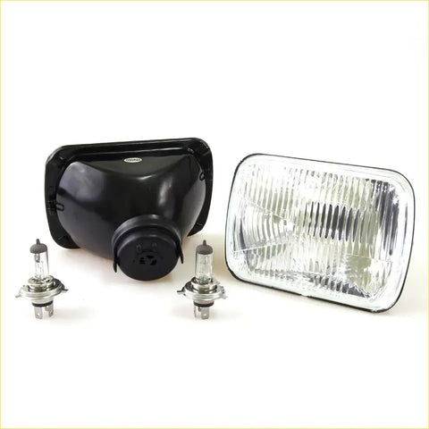 Black plastic headlight housing with clear glass lens and two silver halogen bulbs for toyota hilux 1979-1983