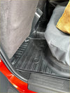Black rubber heavy duty car floor mat with ribbed texture and circular cutouts for mitsubishi triton 2015-2023