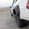 Black plastic fender flare on white hilux n80 ute showing offroad style for 4wd use