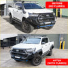 White toyota hilux ute with black front bumper, side steps, roof rack, offroad tires, and n80 gr style flares for 4wd use